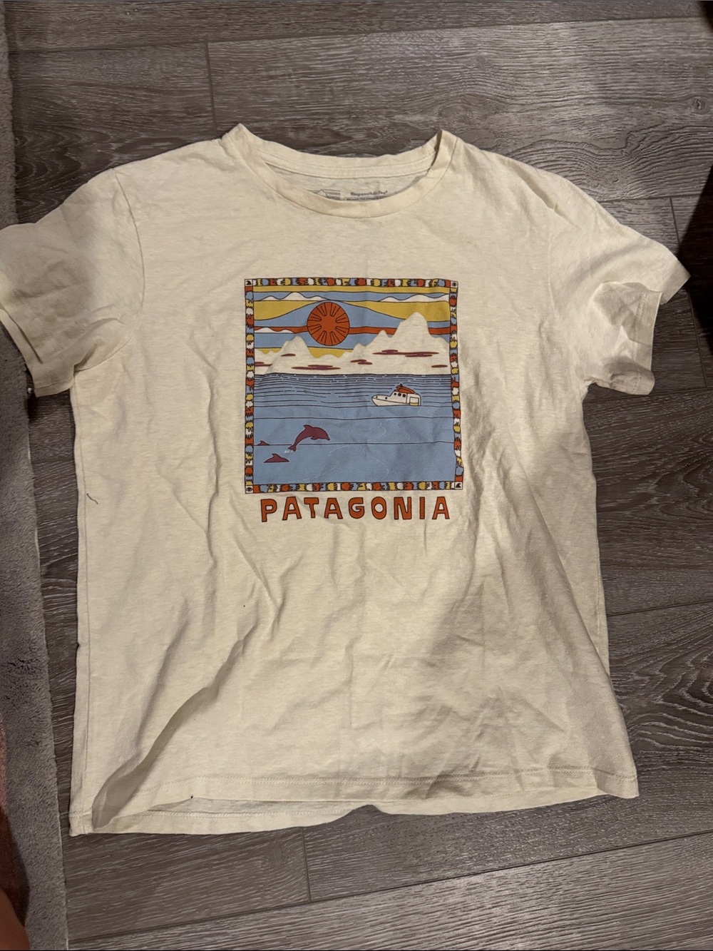 Patagonia women’s Cream Graphic Tee with Blue & Orange Art